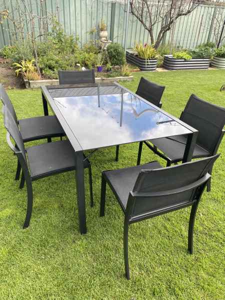 glass patio table and 6 chairs