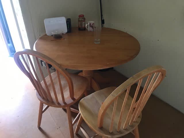 pine table and two chairs