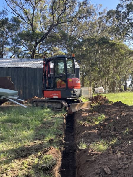 Mini excavator and operator 62863416697986114