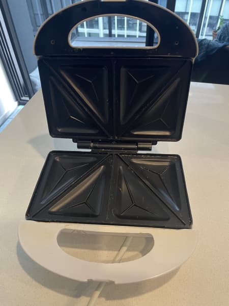 Kmart $35 four-in-one multi snack maker that bakes waffles, doughnuts and  pancake