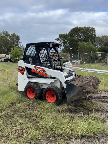 Mini excavator and operator 62863416697986112
