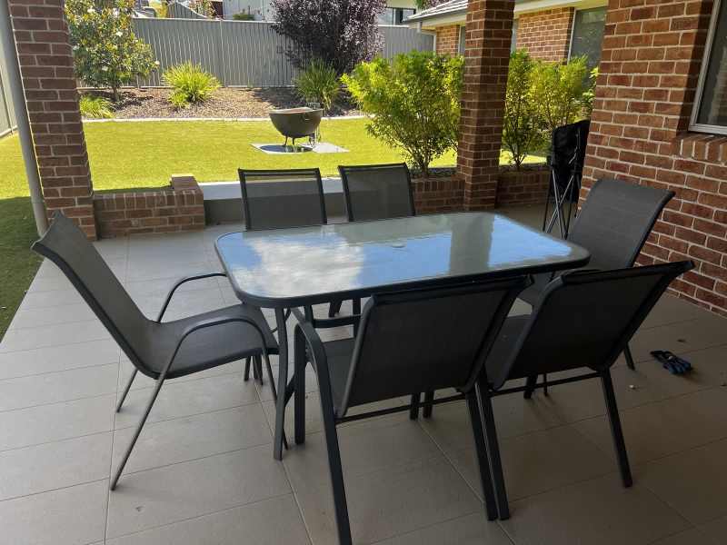 outdoor table with 6 chairs and umbrella