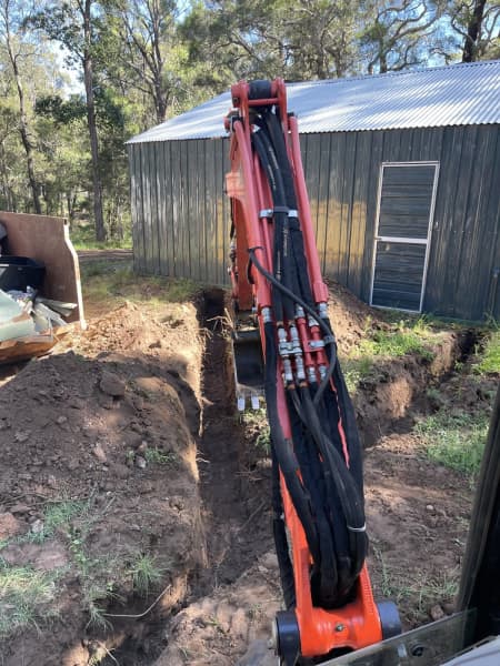 Mini excavator and operator 62863416697986113