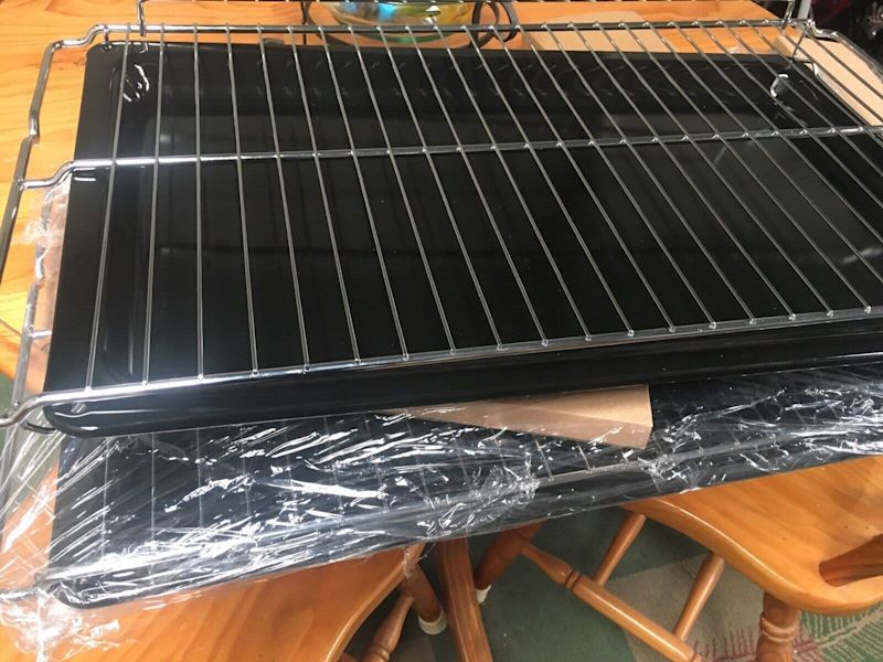 Stainless steel rack and oven tray brand new.63442571361794111