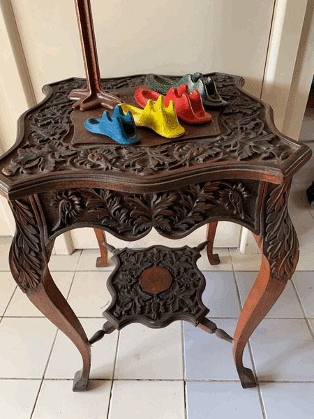 CARVED side table from South Africa.62865820974465113