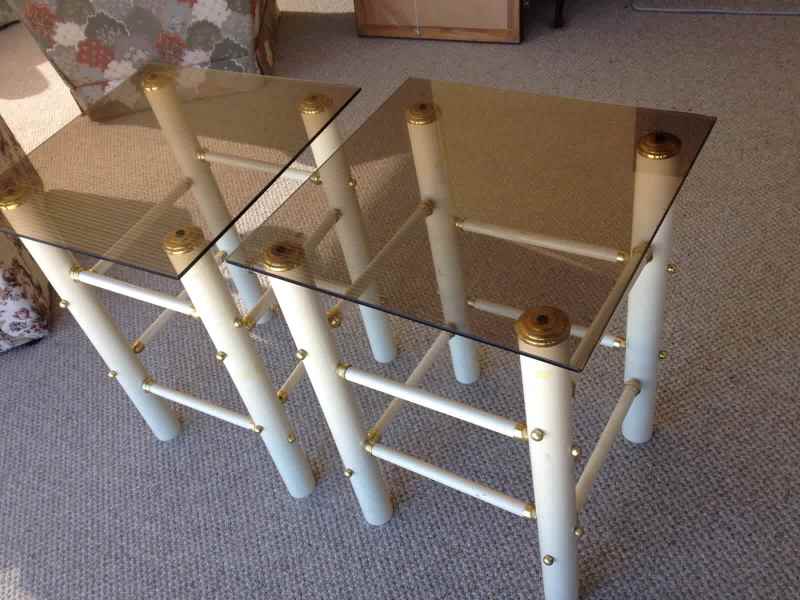 Two glass topped side tables.      Binda628634080209951128