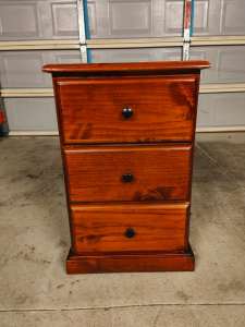 One wooden bedside table
