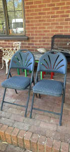 2 phoenix folding metal chairs