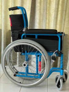 BRAND NEW MLE Economy wheelchair light blue in original packaging. 