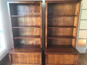 Two timber bookshelves with chest base