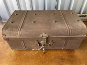 Antique metal travel trunk