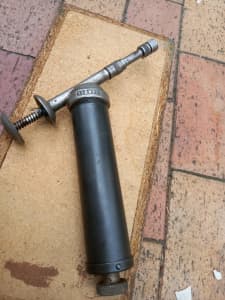 A very old grease gun 