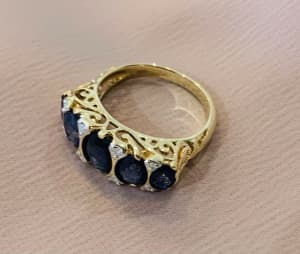 Royal blue sapphire and diamond gold ring.