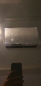 Nintendo 3ds Console with 5 pokemon games.
