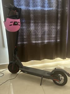 Electric scooter with helmet and charger