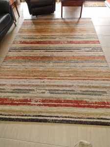 Rug approximately 2m X 3m.