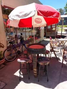 bar table, barrel top with stools, umbrella