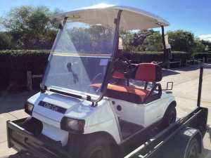Golf Cart- Club Car with Trailer and integrated ramp.