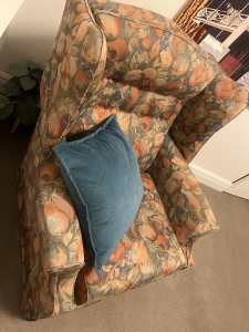 Large armchair with peach / floral design