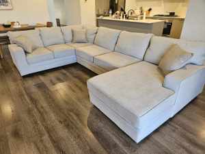 Large grey chaise lounge couch setting