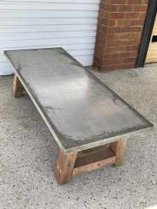 Natural concrete coffee table with hardwood legs