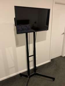 Mobile TV stand with 82cm TV