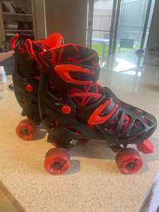 Roller skates black and red in colour