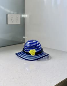 Blue swirled design art glass hat ornament.