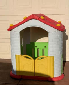 Cubby house with barn door and table great play space Compact cubby