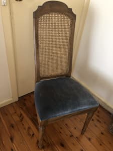 Two wicker back dinning chairs