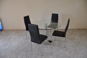 Round glass dining table and 4 chairs