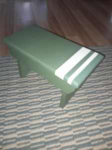 Upcycled green foot stool.