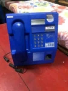Retro vintage blue pay phone for man cave display