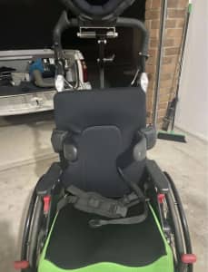 Child’s disability wheelchair with removable table
