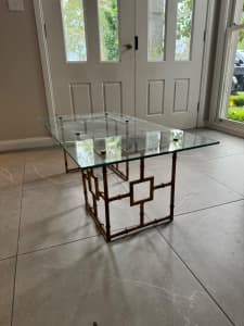 Glass and brass coloured metal coffee table