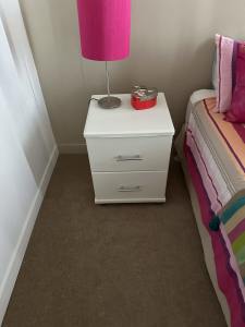 2 white bedside tables