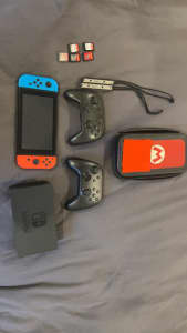 Nintendo Switch with games and controllers