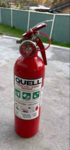 AS NEW - QUELL DRY POWDER STORED PRESSURE FIRE EXTINGUISHER