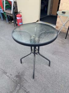 Nice Round glass outdoor table in good condition
