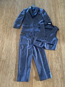A 3 piece grey suit for a 6 year old boy with bonus white shirt