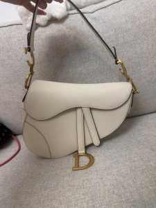 white Dior saddle bag