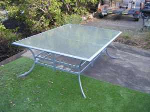OUTDOOR FURNITURE SPECIALISTS SILVER GLASS TOP OUTDOOR DINING TABLE