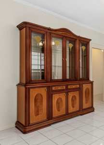 Wall unit with glass display, draws, cupboards.