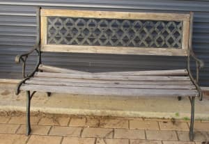 Solid wrought iron bench seat needs repair to one wooden slat