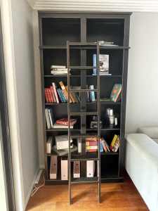 Designer black bookcases with ladder