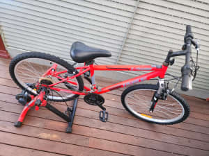 Red bike with stand for sale