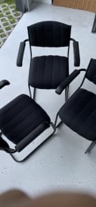 Black chairs with armrests - 3 in total