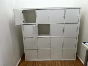16 box Ikea book shelves with doors on all boxes - white