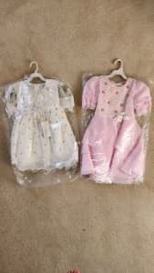 Brand new girls dresses, 6month to 1year old $10 for both