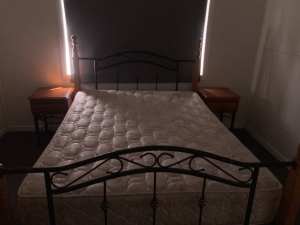 Queen size bed with bedside tables